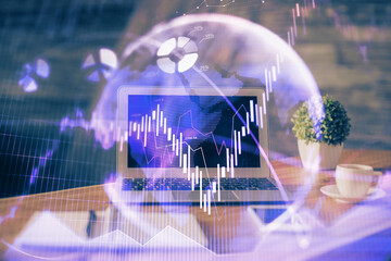Financial graph colorful drawing and table with computer on background. Double exposure. Concept of...