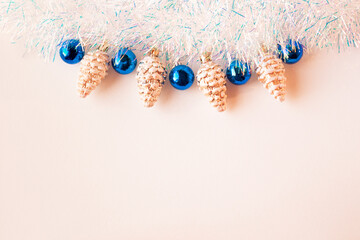 Christmas composition.Christmas decorations in blue and gold on a beige background. Flat lay,copy space.