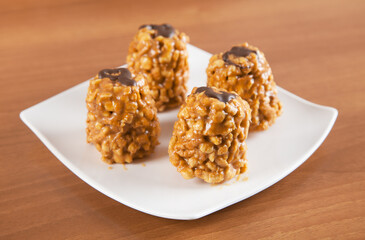 Delicious freshly baked anthill with plate on a wooden table.