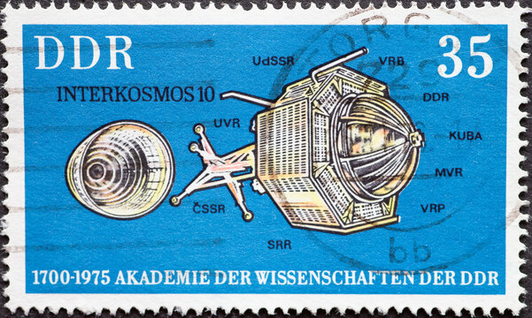 GERMANY, DDR - CIRCA 1975 : a postage stamp from Germany, GDR showing the Interkosmos 10 satellite. 275 years of the Academy of Sciences, Berlin