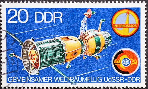 GERMANY, DDR - CIRCA 1978 : a postage stamp from Germany, GDR showinga Soyuz 31 spaceship, Interkosmos symbol, emblem of the first joint USSR-GDR space flight