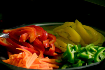 vegetables on a plate, chopped vegetables,  tomato cut, Potato, capsicum, raw food, vegetarian, kitchen, preparation, close-up of vegetables, 