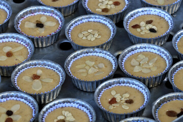 Banana cakes are packed in paper cups placed in a large aluminum steamer. Ready to steam it into a delicious banana cake.