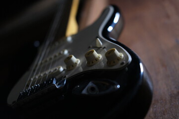 Electric guitar photo, focus on the volume knob
