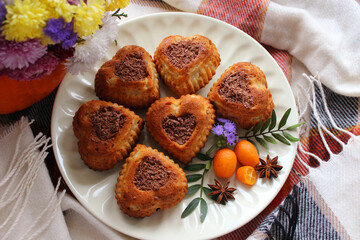 Homemade cupcakes in the shape of a heart and sprinkled with grated chocolate
