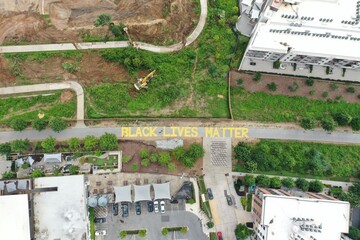 "Black Lives Matter" Written on the Atlanta Beltline in Yellow Letters - Atlanta, GA, Aerial View