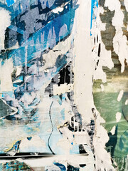 Vintage old posters stuck and torn on the wall in your grunge background