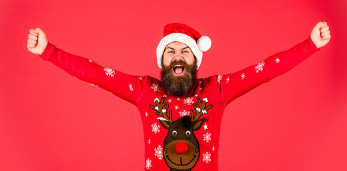 freedom feeling. brutal bearded male red background. party man in Christmas sweater. happy caucasian guy await new year present. lets have fun. Santa Claus hipster. handsome man at Christmas - Powered by Adobe