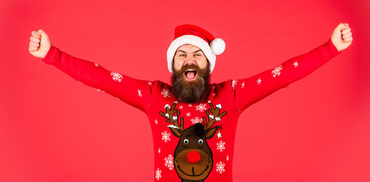 freedom feeling. brutal bearded male red background. party man in Christmas sweater. happy caucasian guy await new year present. lets have fun. Santa Claus hipster. handsome man at Christmas
