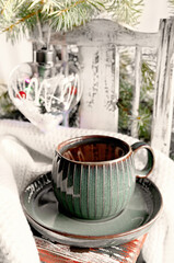 Cup of tea or coffee with a kettle for Christmas. Christmas still life