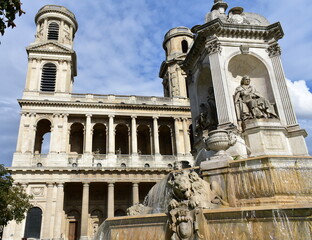 Obraz premium Eglise Saint-Sulpice de Paris neoclassical facade and towers with Fontaine Saint-Sulpice. Paris, France.