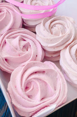 fresh handmade marshmallows in a light mood. Close-up of a pink marshmallow in a box for sale. Sale of handmade confectionery