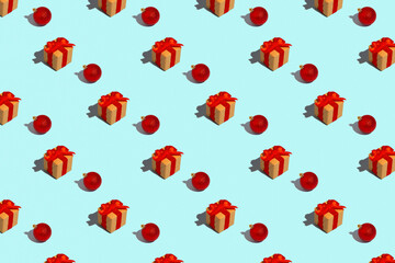 Seamless regular pattern with Christmas balls and gift boxes on a light blue background. Hard light. New Year and Christmas concept.
