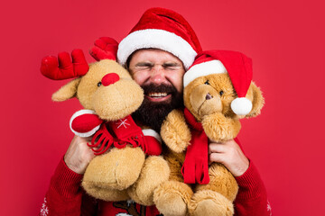 Love is in the air. merry christmas to you. xmas shopping time. prepare gifts and presents. reindeer and bear toy. happy bearded man in santa claus hat. new year party. celebrate winter holidays
