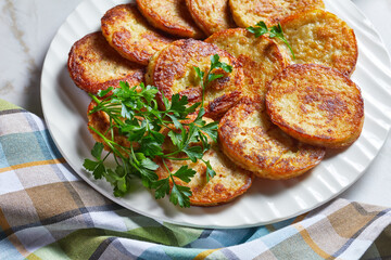 Potato pancakes on a light marble background