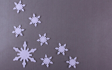Gray background with white snowflakes