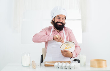 handsome man with beard and moustache cooking food, prepare food