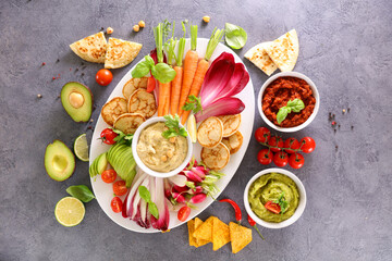 assorted of fresh vegetables and dips- hummus and raw vegetable-healthy eating