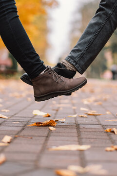 Physical Distance And Friendship Safety Greetings Concept. Young Women Doing New Social Distancing Greet With Legs Bumps For Preventing Corona Virus Spread