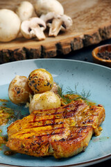 pork steak with fried champignons with ingredients in background