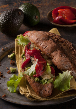 Veggie rolls with avocado cream, grilled vegetables, lettuce and chilli