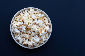 Popcorn on dark background. Copy space