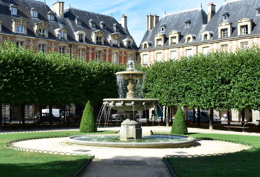 Fountain at Place des Vosges, the oldest square in the city located at Le Marais district. Paris, France.