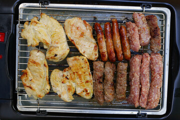 Top view of a bbq meat kebab,chicket meat and sausages.Flat lay,above,close up.