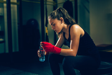 young woman preparing for boxing training