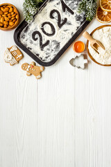 Cooking background with icing gingerbread cookies for Christmas, top view