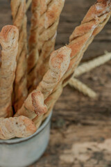 Italian grissini, bread sticks. Italian appetizer. Wooden table. Top view.