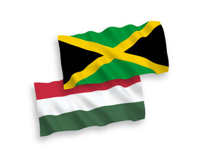 National vector fabric wave flags of Jamaica and Hungary isolated on white background. 1 to 2 proportion.