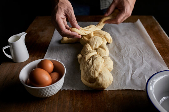 A braided loaf being made