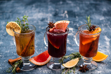 Various autumn or winter seasonal alcohol hot cocktails - mulled wine, grog, warm ginger ale, hot...