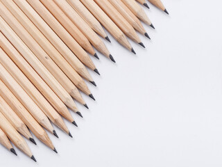 many simple pencils with a lead on a white background