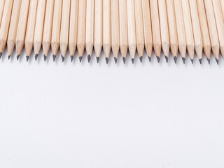 many simple pencils with a lead on a white background