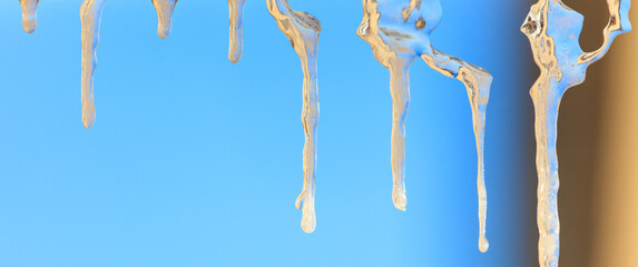 Fototapeta premium Icicles in winter against a blue sky.
