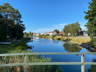 reflection of trees in lake swedish summer © Tommy