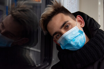 Young attractive guy in a mask. Diseases and protection.