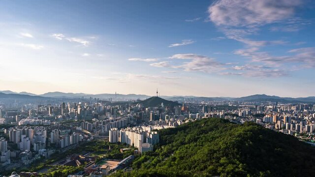 Time lapse 4K Seoul city skyline and Seoul tower modern building and architecture, Beautiful clouds flow through in Seoul, South Korea.