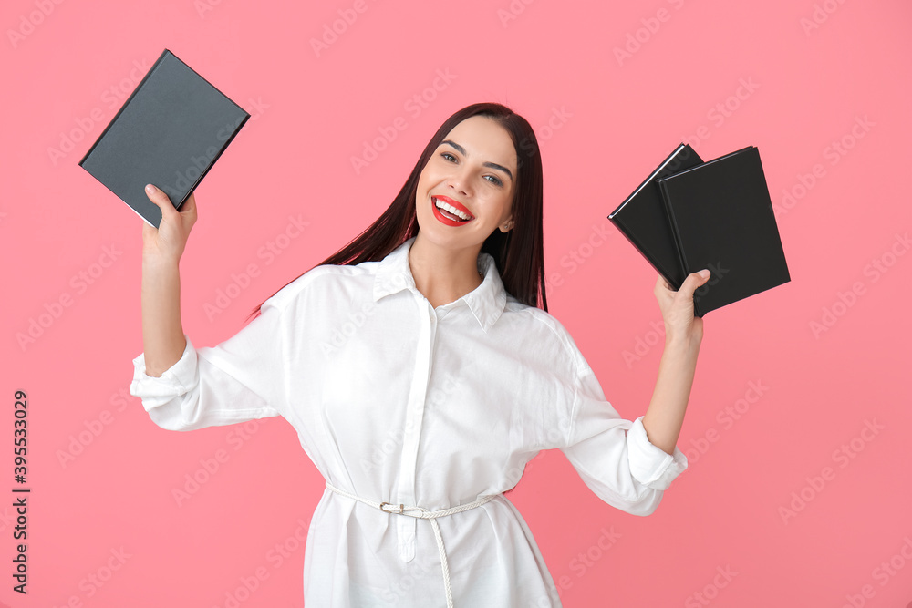 Sticker Young woman with books on color background