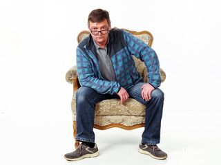 man in a comfortable vintage chair made of wood on a white background