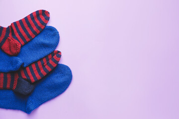 Warm socks on color background
