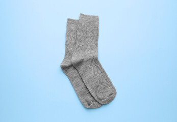 Warm socks on color background