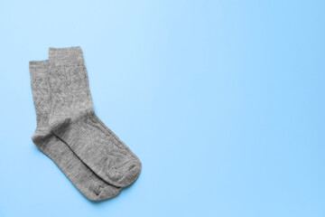 Warm socks on color background