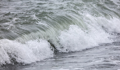 Wave in the sea with splashing water.