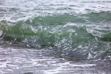 Wave in the sea with splashing water.