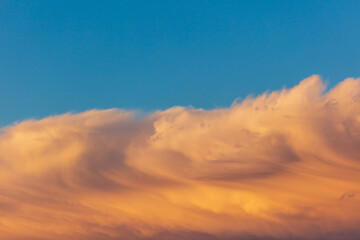 Colorful clouds at sunset as background.