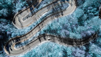 Mountain roads details with colourful landscape with no traffic and winter snowy trees