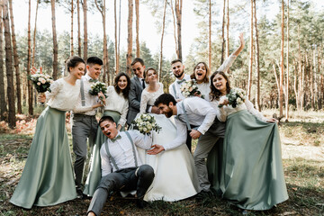 international wedding with friends,close friends congratulate the newlyweds,cheerful and happy wedding group of people,wedding friendships,wedding day